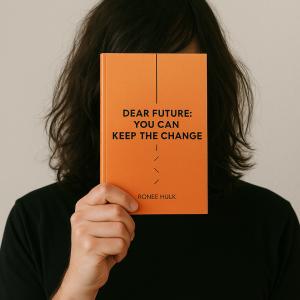Photo of anonymous author Ronee Hulk holding his book 'Dear Future: You Can Keep The Change'