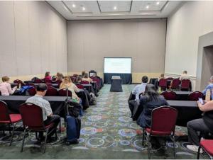 Audience members seated during the TESOL presentation session where an ITSC Senior Researcher presented G-TELP research.
