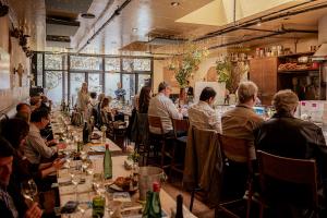 a group of people at a wine lunch