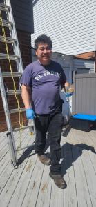 Gary Chan from Guard More Pest Control removing baby raccoons