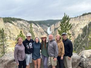 Private family tour group at Artist Point, Grand Canyon of the Yellowstone, Lower Falls in background, Teton Excursions