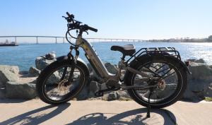 AIMA Big Sur 2.0 fat tire electric bicycle parked outdoors, featuring an upgraded parallel engineering frame and optimized Bafang motor system.
