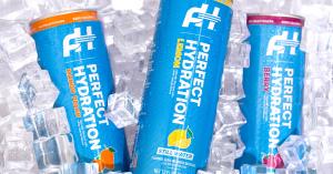 New Perfect Hydration flavored alkaline water 12 oz blue cans in Berry, Lemon and Mango Peach cold and refreshing on ice