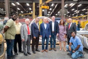 Houston Mayor John Whitmire and company representatives walk through the outdoor manufacturing area at Piping Technology & Products during a facility tour.