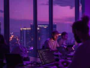 QScout cybersecurity operations team working on quantum and cyber risk intelligence analysis.