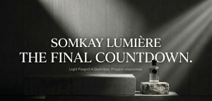 Minimalist luxury bottles of Somkay Lumiere high-concentration alcohol-free oil fragrance extraits on a textured background.