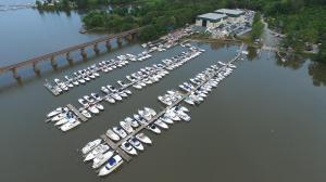 Aerial drone view of Hope Springs Marina in Stafford, Virginia featuring multiple wet slips, protected water access, marina facilities, and surrounding waterfront landscape along Aquia Creek.