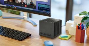 KUBB® Fanless Ultra X7 silent AI mini PC powered by Intel® Core™ Ultra processor with fanless cooling and Intel® Arc™ graphics on a modern workspace desk.