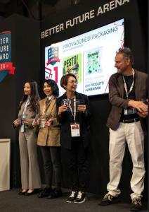 Mindy Jen, Founder of BOBA CHiC, accepts the award on stage.