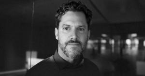 Black and white portrait of Christopher MacDonald, Co-Founder of Fract75, a fractional leadership and execution infrastructure platform.