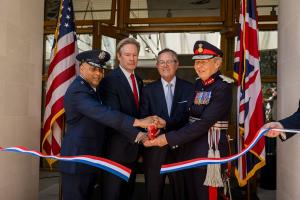 Maj. Gen. Akshai M. Gandhi, U.S. European Command; ABMC Commissioner John Freeman; Warren A. Stephens, U.S. Ambassador to the United Kingdom; and His Majesty’s Lord Lieutenant of Cambridgeshire Julie Spence, cut the ribbon dedicating the visitor center at