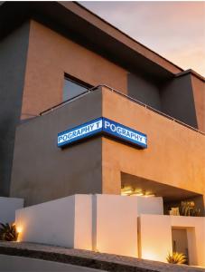 High-brightness outdoor LED corner billboard mounted on a commercial building facade using IP65-rated Blue Flame Series display technology.
