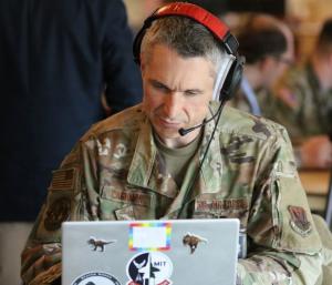 U.S. Air Force Officer with Headphones During a Cyber Drill