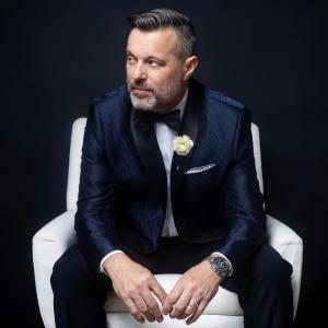 Steve Falcon sitting on a chair. His Comedy Hypnosis Hour at the Underground Theater inside MGM Grand Hotel & Casino is perfect for bachelor and bachelorette parties, birthdays, convention groups, date nights, and adults looking for a wildly different nig