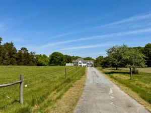 4 BR/6 BA home w/horse barn, fencing, detached work shop, garage and storage buildings on 30.8 +/- Acres in Halifax County, VA