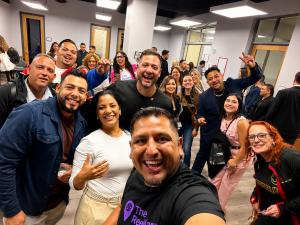 Group selfie of Robert Gomez and real estate agents at a ReelMap community event focused on video marketing and local real estate discovery.