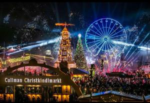 Epic lighting over the Cullman Christkindlmarkt Schwibbogen, Christmas Pyramid, Christmas Tree, and Ferris Wheel with around 20,000 in attendance that night.