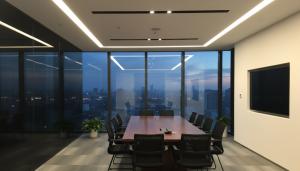 Smart Glass shown in a black and dark state in a boardroom
