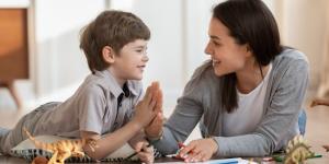 Babysitter high-five a child in game