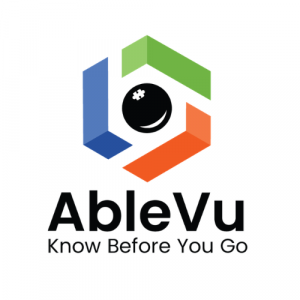 AbleVu logo with autism puzzle piece as the iris of an eye and orange, green, and blue encircling the eye or lens. Has the words know before you go under