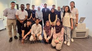 Group photo of Robotimize team, Even Koh, Prof. Nur Azah and UM students.