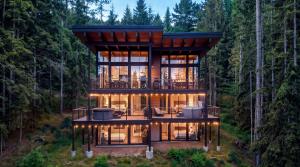 The Mountainside House at Snoqualmie Pass Washington — three-story mountain vacation rental with floor-to-ceiling windows, private hot tub, and covered decks with access to Cascade hiking and biking trails near Seattle