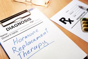 a medical clipboard with a prescription and the words bioidentical hormone replacement therapy