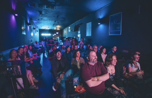Audience members enjoy a show at Astronaut City. Photo by Luis Lagos.