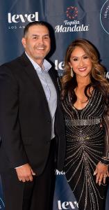 Lorraine Aceves, Founder of Ignite the Light and husband, Oscar Aceves walk red carpet