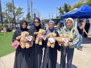 Members of the Islamic Center of San Diego before Friday prayer service with their weighted therapeutic Comfort Cubs after the deadly mass shooting on May 18th, 2026.