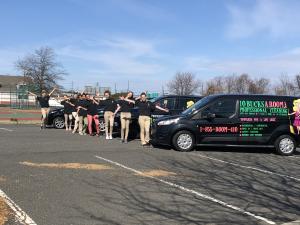 10BucksARoom cleaning team with branded vehicles