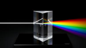A museum-grade optical glass prism on a black reflective surface refracting a single white beam of light into a precise full spectrum — visual representation of the PRISM methodology by EOP Media.