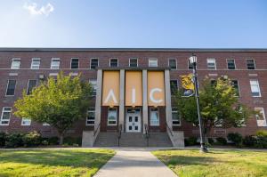 American International College banner displayed outside Amaron Hall on the AIC campus in Springfield, Massachusetts.