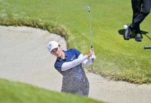 Janet Xiyu Lin hitting a ball out of the sand trap at Riviera Country Club during a practice round for the 2026 US Open.