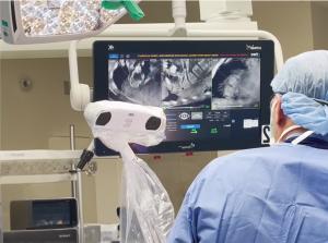 OR photo showing the nView system navigation camera and an image in the overhead display