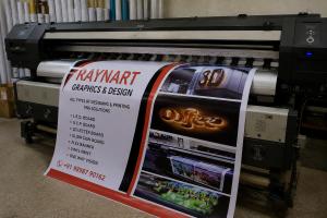 Professional flex banner printing machine producing large-format advertising banners at RAYNART GRAPHICS & DESIGN in Ahmedabad