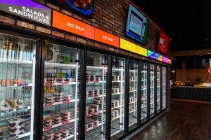 Fork to Fit Kitchen has signed 4 new franchise locations for the San Antonio area - Image of store interior showing ready-t-buy meals in coolers