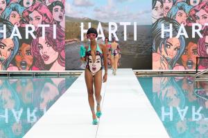 Harti Model wears the St James halterneck swimsuit featuring hand painted pop art on sustainable swimwear at Miami Swim Week The Shows