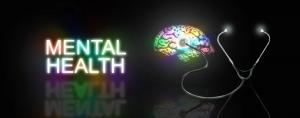 photo with a black background, a photo of a brain in many colors, with a stethoscope attached and in large letters the words MENTAL HEALTH