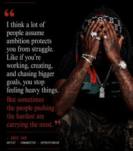 Erie Ave sits with his head in his hands against a dark background in promotional artwork for Terrence’s Interlude. The image features a quote about ambition, struggle, and resilience, highlighting the idea that people who push the hardest are often carry