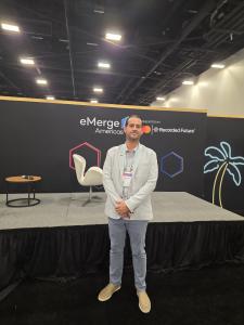 TalentoHC CEO Juan Gaitan standing in front of the eMerge Americas stage, supporting the launch of Project Evolution and regional talent strategy.