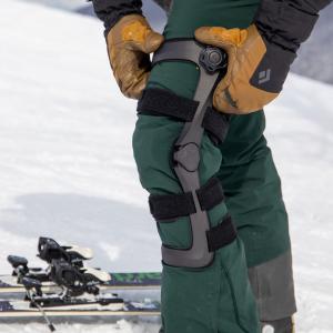 The Icarus Ascender Knee Brace being worn during activity to provide unloading, stability, and mobility support for knee conditions.