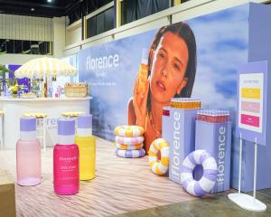 Custom trade show booth designed and built by Florida Event Decor with branded scenic elements and lighting