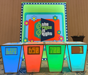Themed corporate gala decor with custom scenic fabrication and event lighting by Florida Event Decor