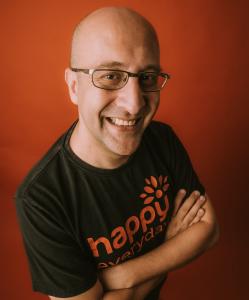 FJ Fatani posing in a happy everyday black t-shirt