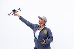 Drone instructor Steffanie Rivers demonstrating FAA-certified drone technology for law enforcement and public safety applications.