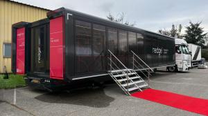 Pulse Trailer marketing roadshow exterior fully deployed with red carpet staircase and Redge On The Road tour branding | The Clear Idea