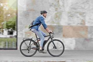 Man cycling along road