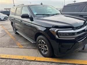 Black Ford Expedition SUV with alloy wheels parked in a lot