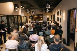 Attendees at a Nashville wellness event learning about EBO2 Therapy, physician-guided wellness programs, and personalized recovery protocols at The Pro2col.